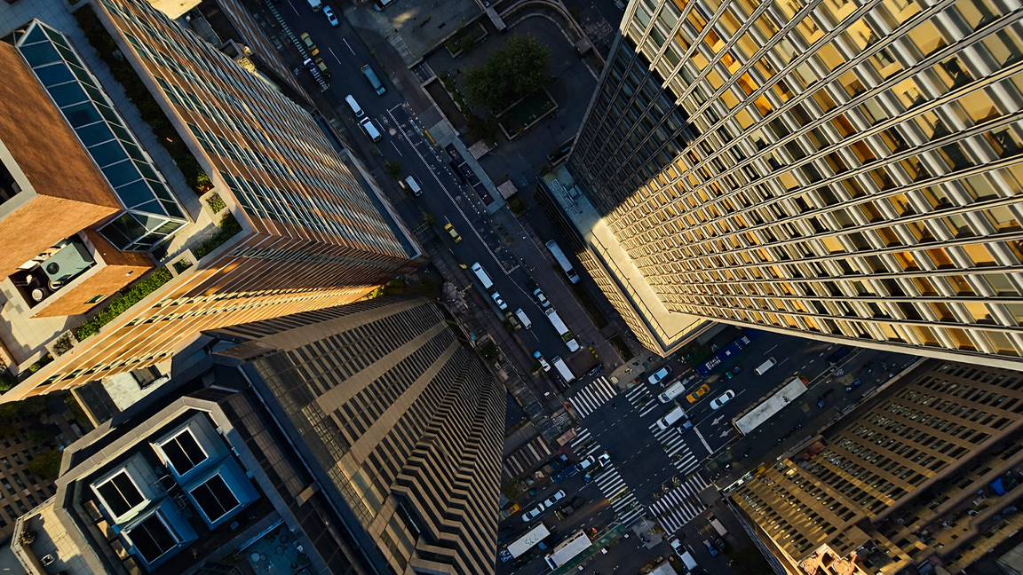 Dramatic urban canyon with streets and skyscrapers from above