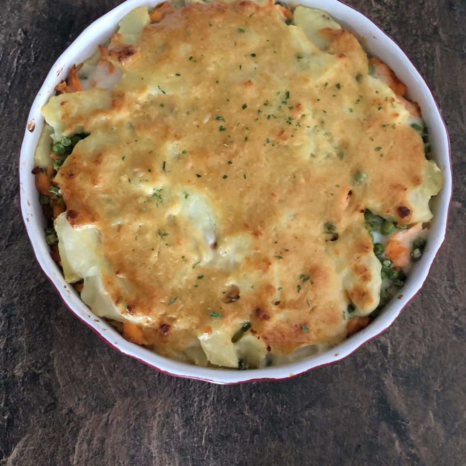 Salmon Casserole Surprise on a wooden background