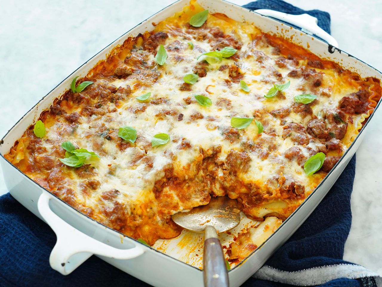 Pan of lasagna with a slice taken out