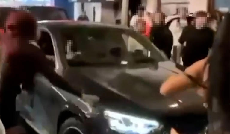 Woman arrested for attempted murder after car ploughs into crowd in ...