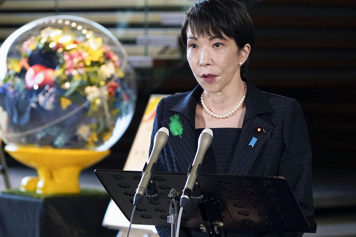 Japan's Prime Minister Sanae Takaichi speaks to media after Japan Meteorological Agency issued a tsunami warning after an earthquake with a preliminary magnitude of 7.4 struck off the northeastern coast of Japan, in Tokyo