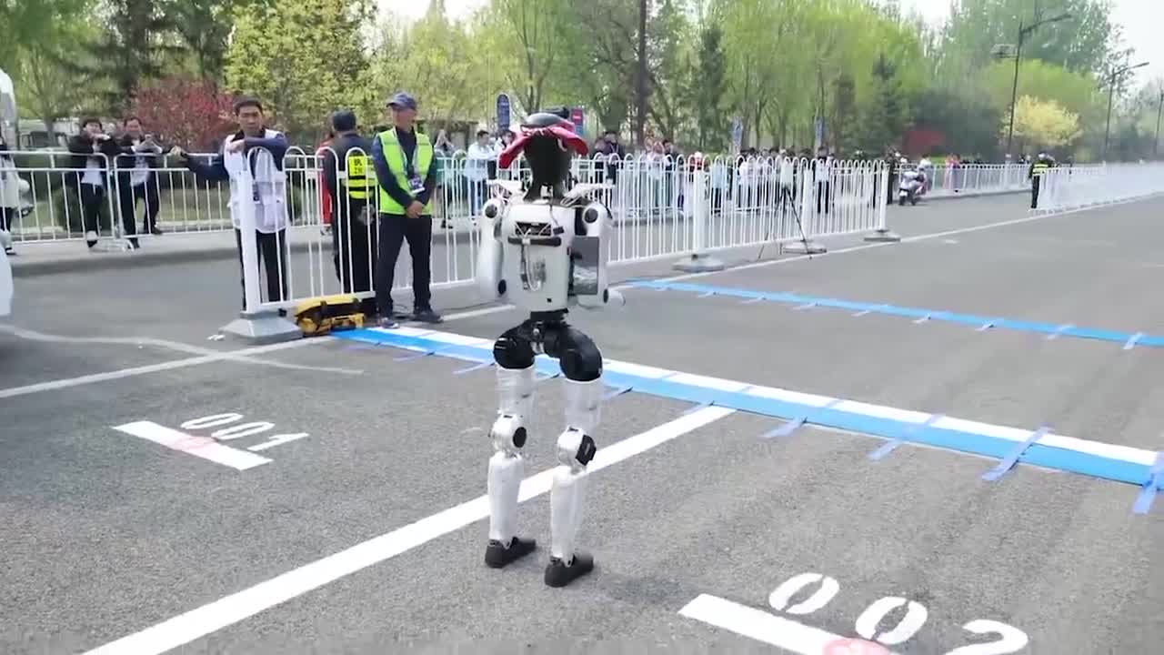 Humanoid bot trips and malfunctions at start of race in China