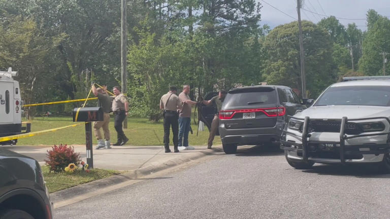 Two in custody after reports of armed person running through neighborhood