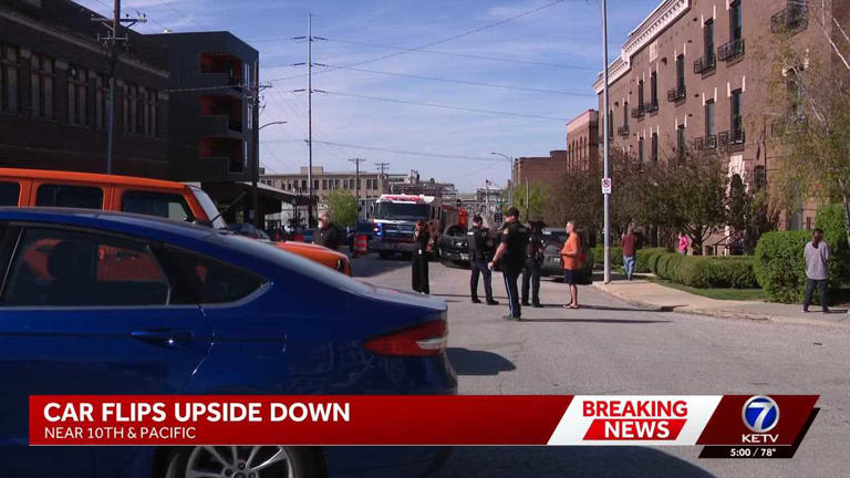Car flips upside down after crash in Omaha