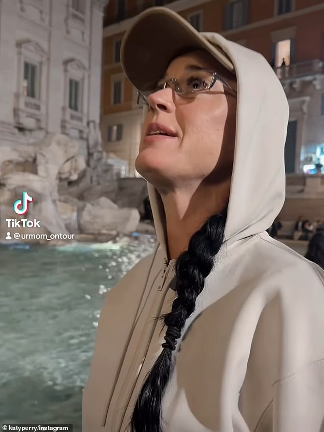 Katy Perry puts her credit card in Rome's Trevi Fountain