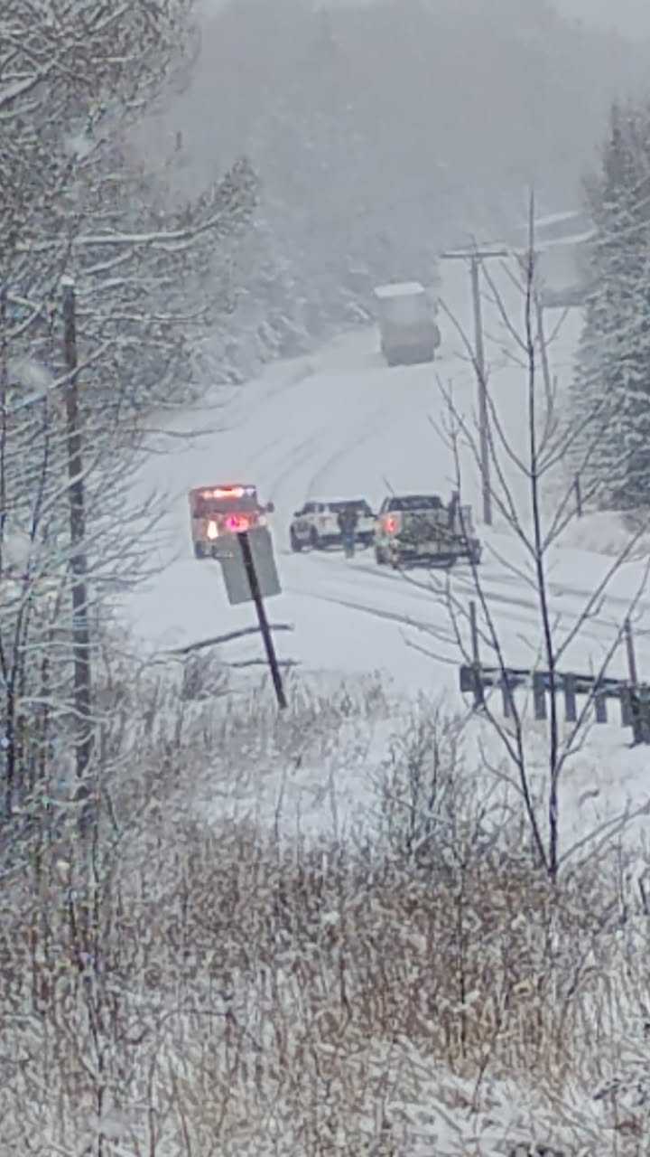 Several trucks stuck, blocking road, as snow falls across the Maine ...