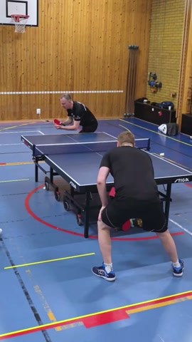 Fast table tennis rally with unexpected spectators