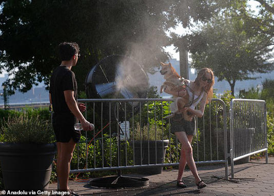 Legionnaires' disease is spread via water vapor. The above shows two people trying to cool off in water vapor while in New York City in July last year