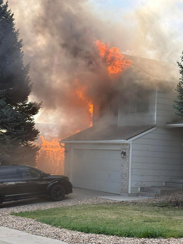 Colorado firefighter rushed to hospital as flames engulf home