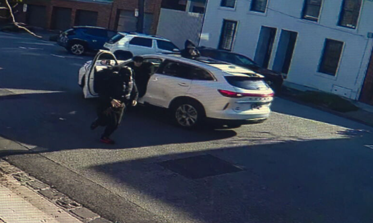 CCTV footage shows a group of balaclava-clad young people hanging out of the sunroof.