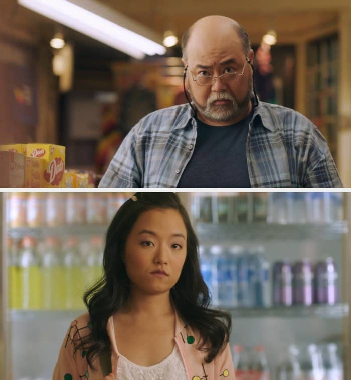 Two people in a grocery store, one wearing a plaid shirt and the other in a patterned cardigan, with expressions of curiosity and contemplation