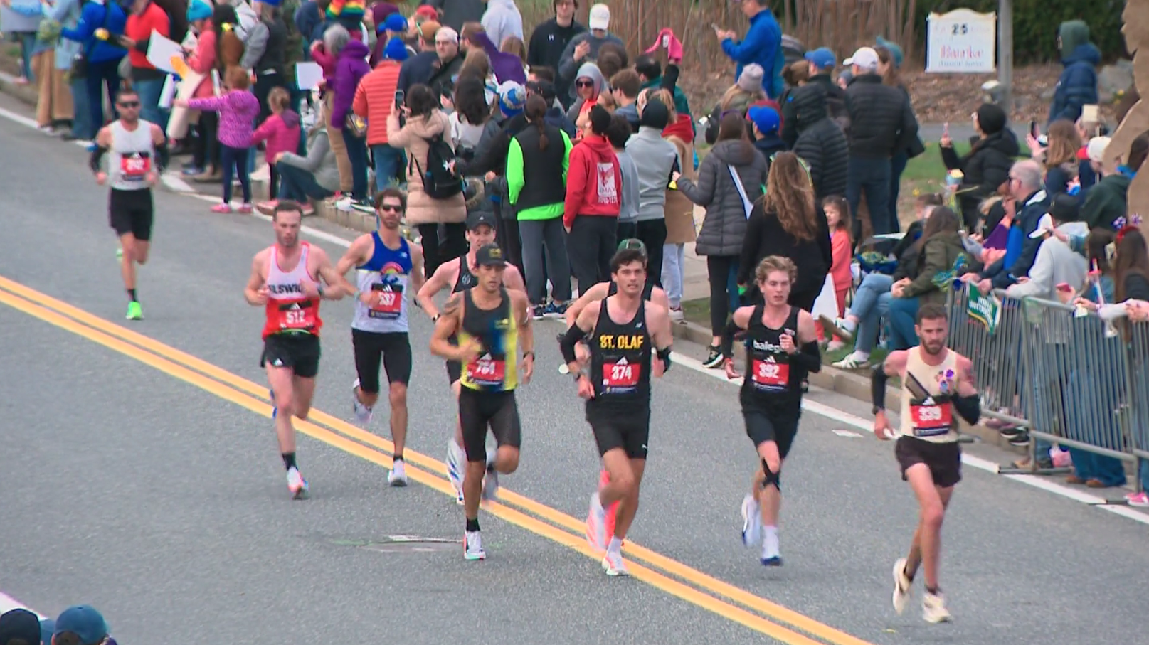 Fans line streets to power athletes along as they race Boston Marathon