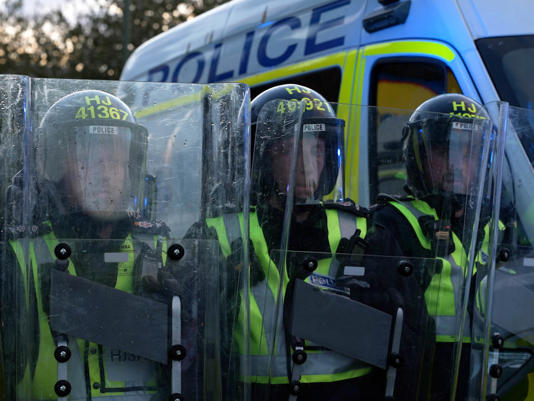 Surrey Police said the protest ‘escalated to public disorder’, with eggs and beer cans being thrown (PA Wire)