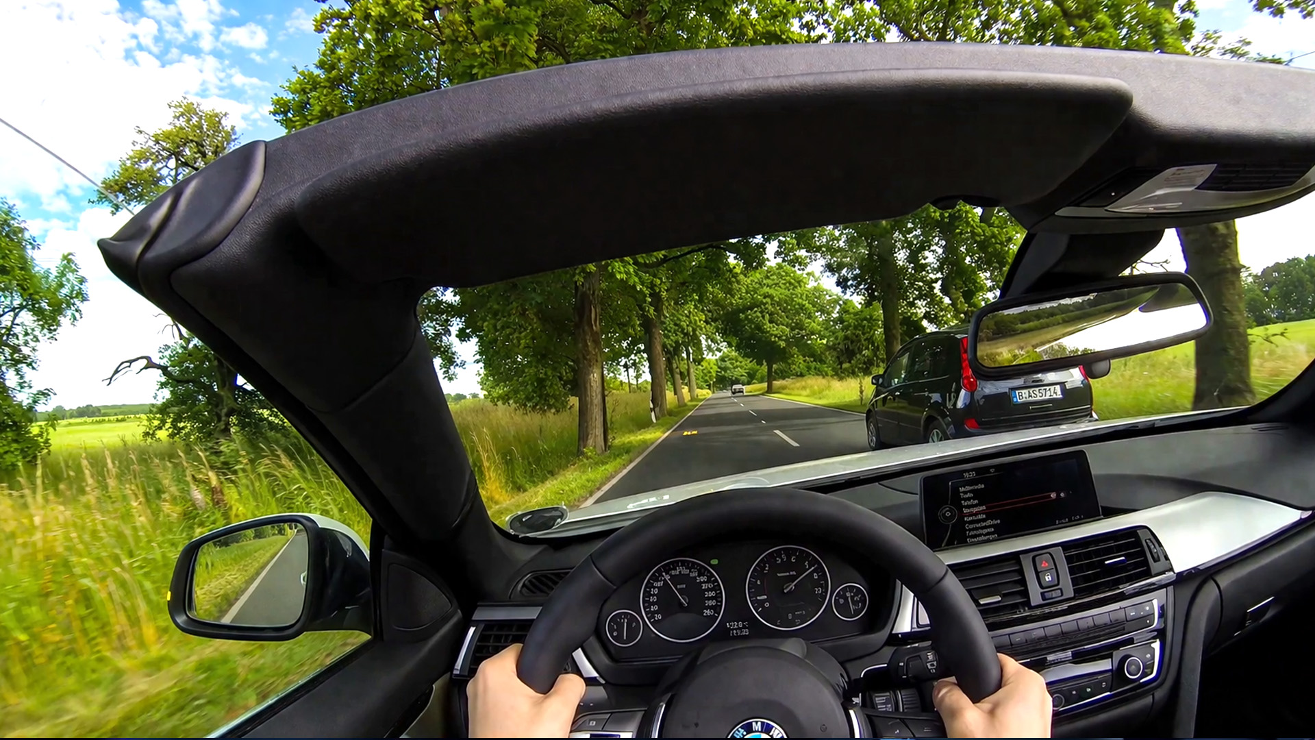 Luxury Cabriolet Cruising Through Country Roads Onboard