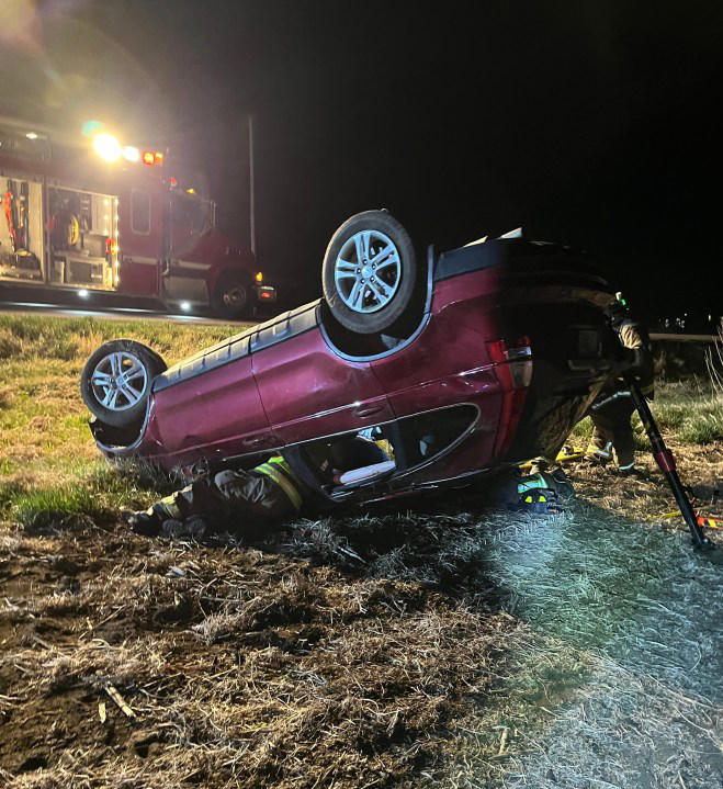 Driver hospitalized after two vehicle rollover crash