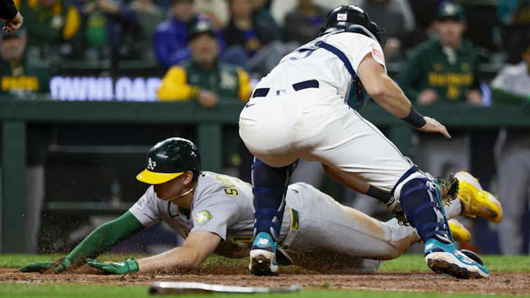 A's capitalize on key moments to take game one over Mariners
