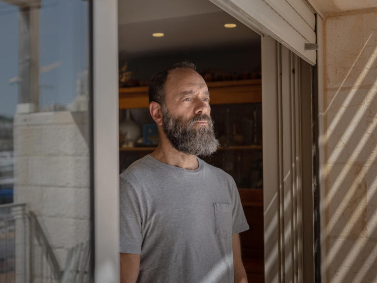 Jon Polin outside his living room in Jerusalem.