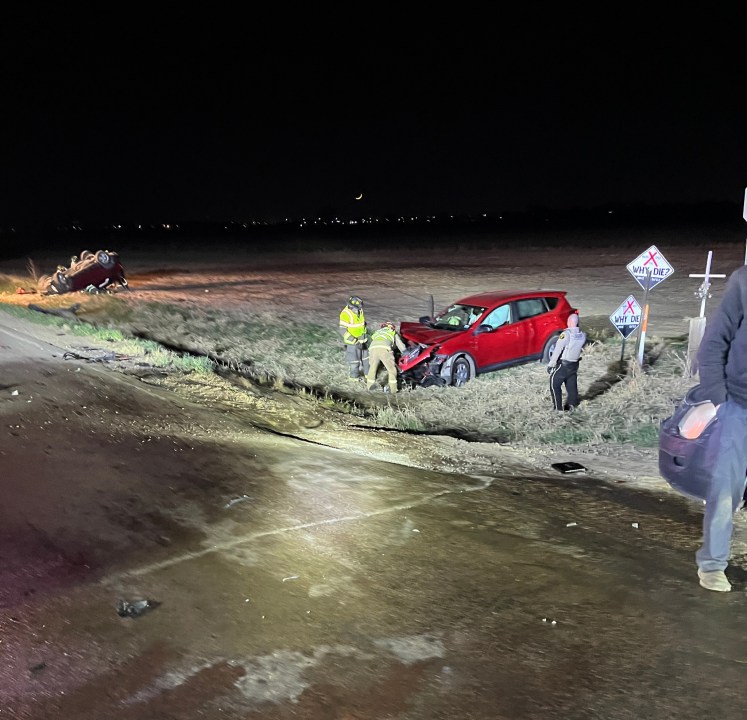Driver hospitalized after two vehicle rollover crash
