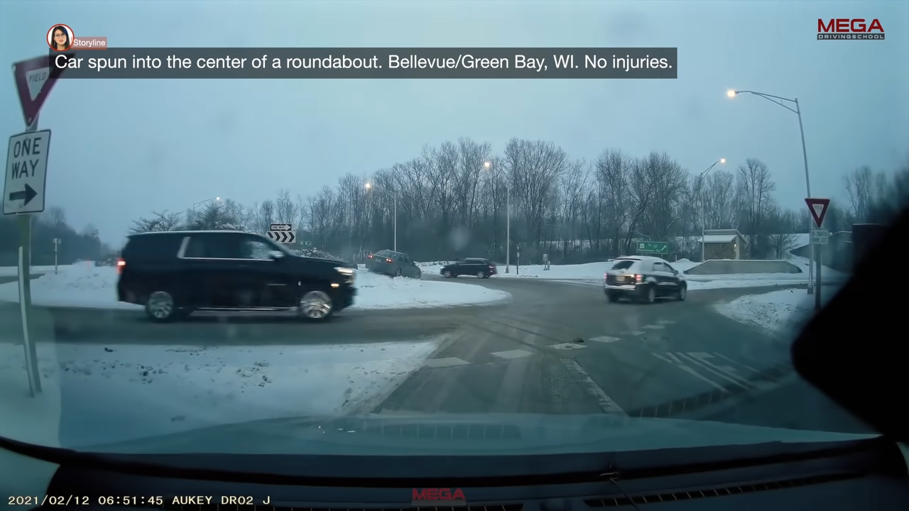 Footage shows car whirling into roundabout center
