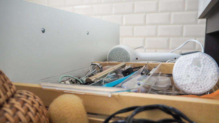 Organize cluttered bathroom drawers by repurposing a common kitchen ...