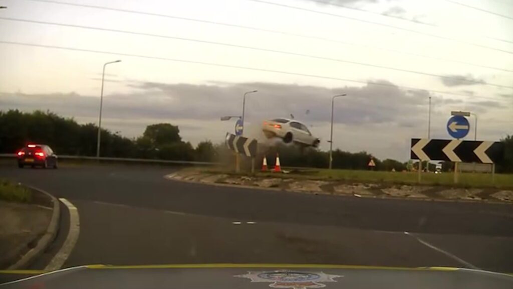 Drug driver flips car after 140mph police chase ends in airborne ...