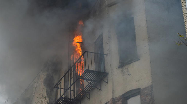 2 dead and 11 injured after enormous blaze tears through, partially ...