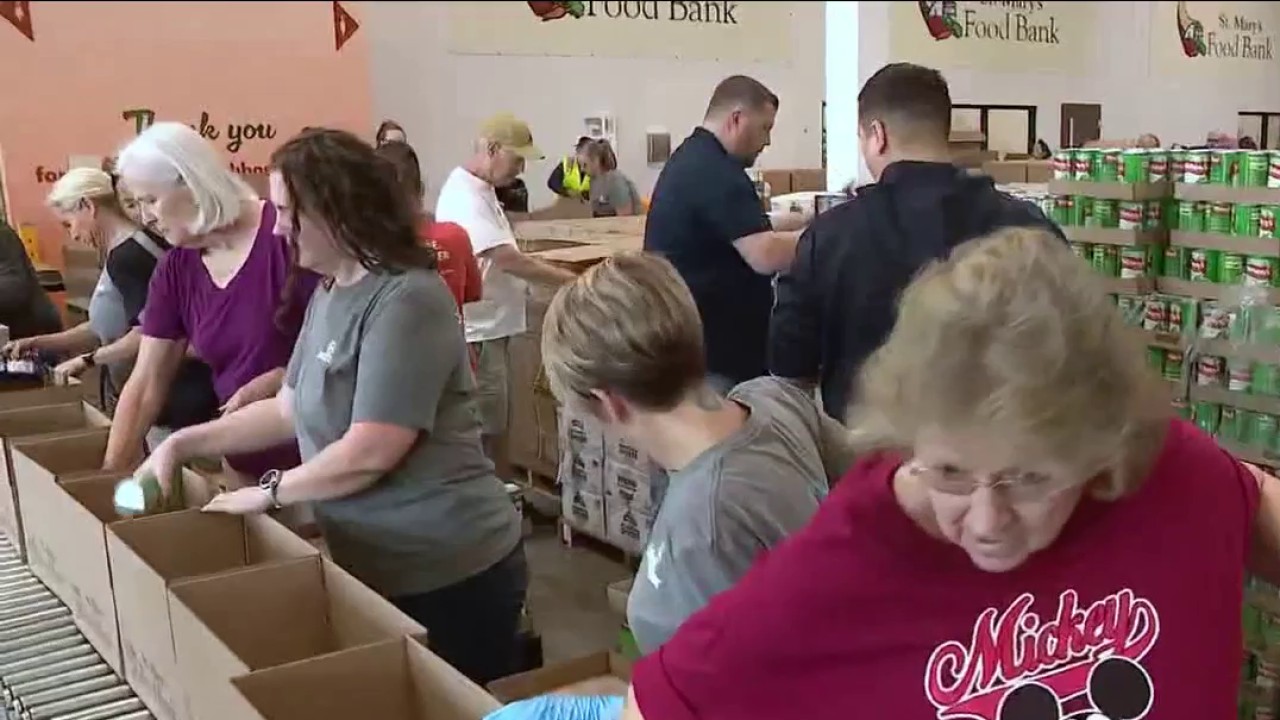 Cardinals, others pack food boxes for food bank