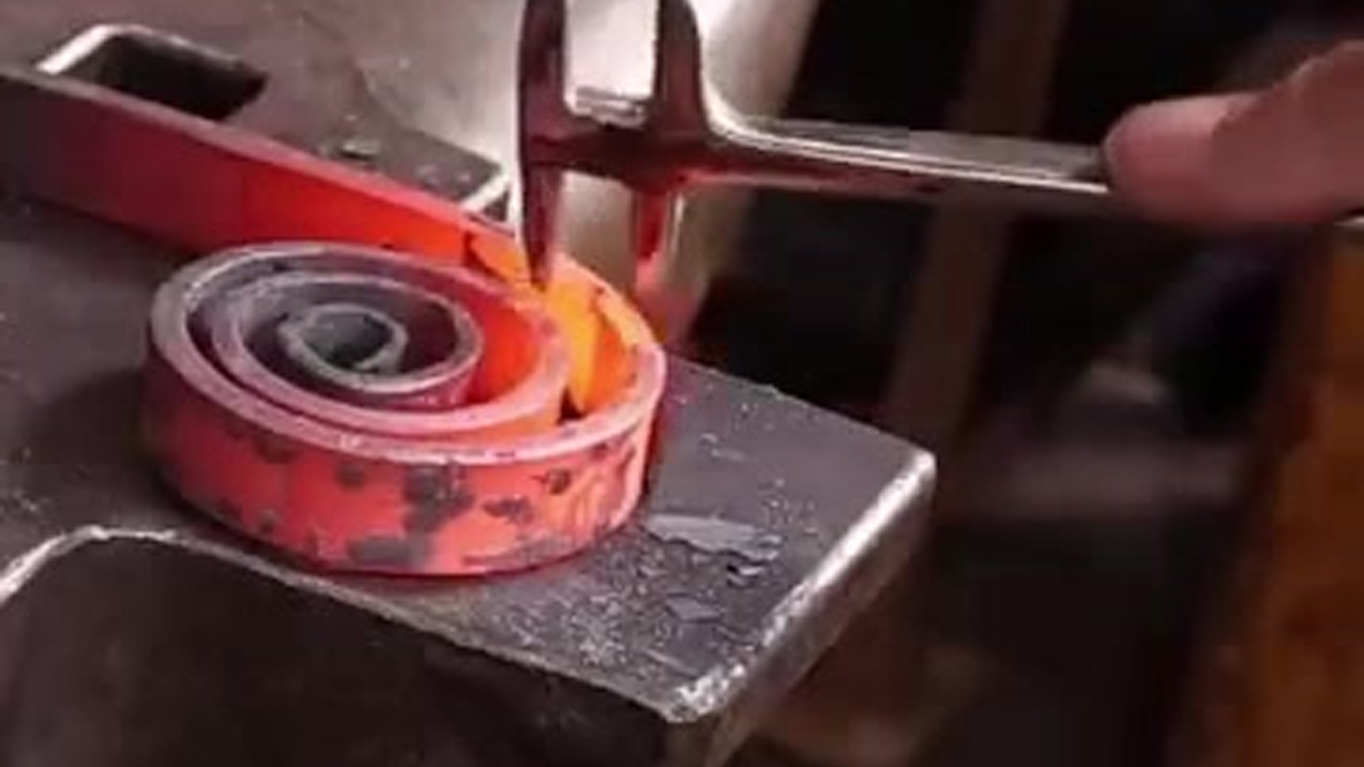 Forging decorative metal scrolls by hand