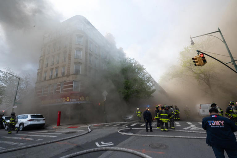 2 dead and 11 injured after enormous blaze tears through, partially ...