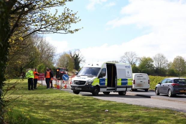 Worker rushed to hospital after being pinned between cabin and van on A690