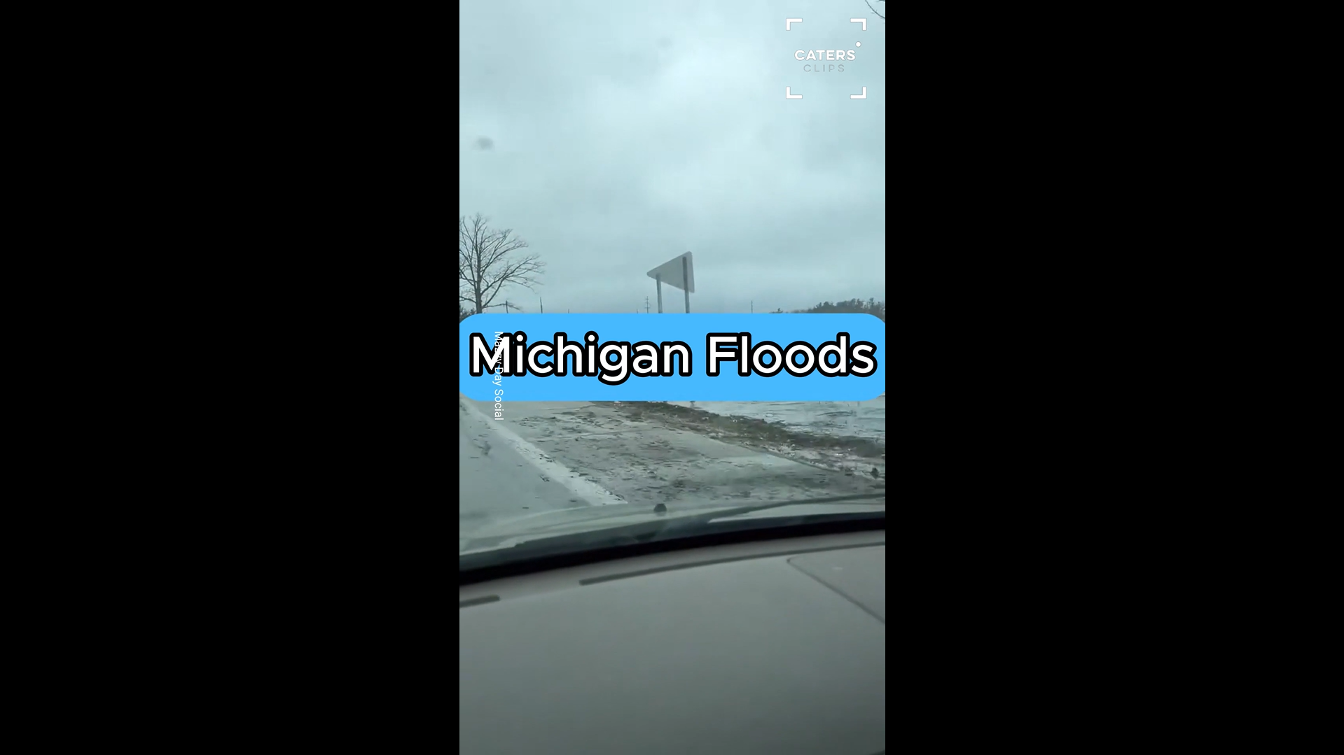 Car drives through severe flooding after heavy rainfall in Michigan
