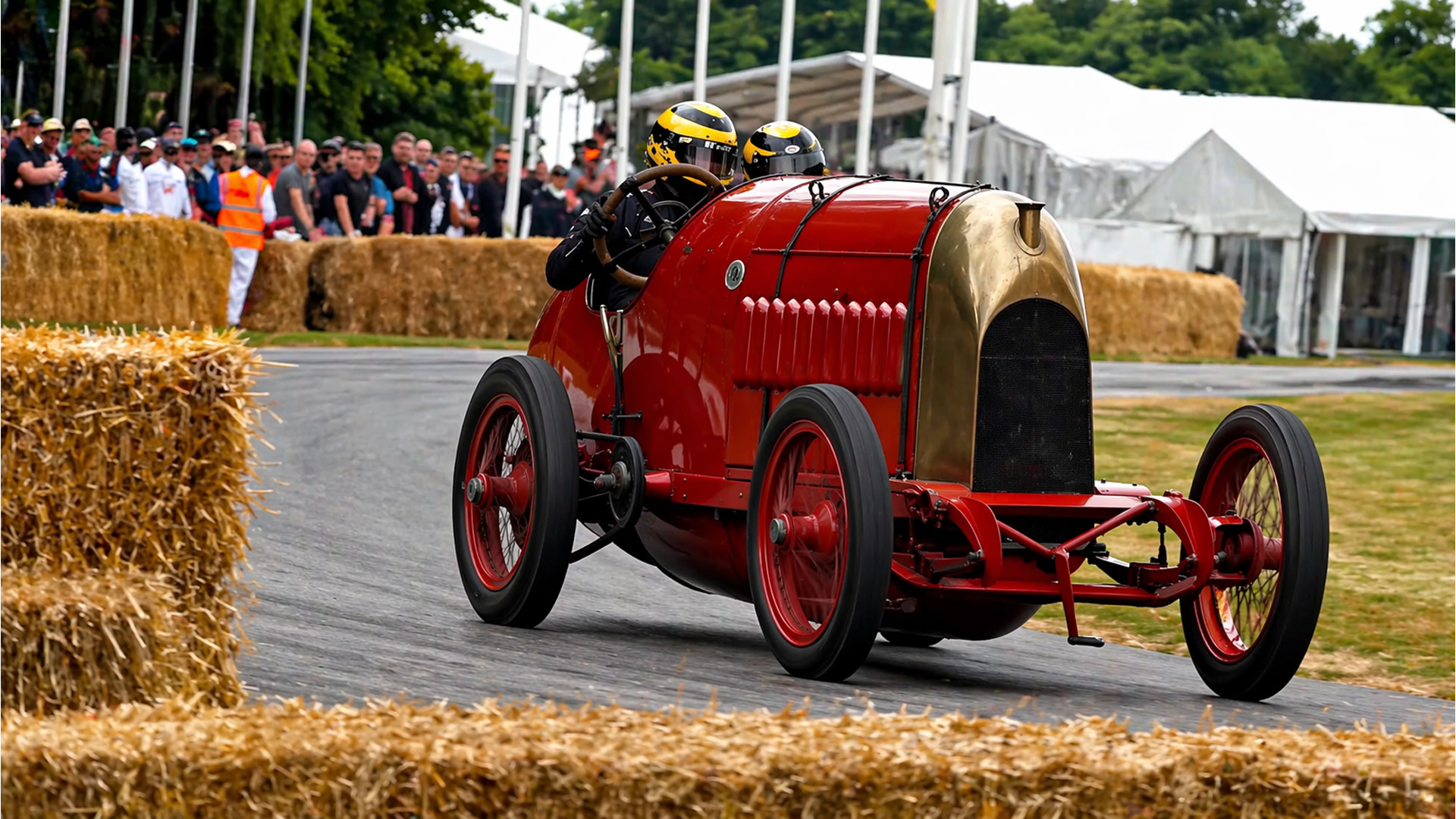 Historic race car Fiat S76 slides through tight corner