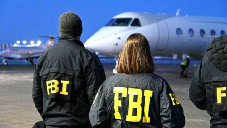 FBI agents stand on the tarmac as a plane arrives carrying Zobaidul Amin following his extradition from Malaysia to face federal charges in Alaska. Fox News