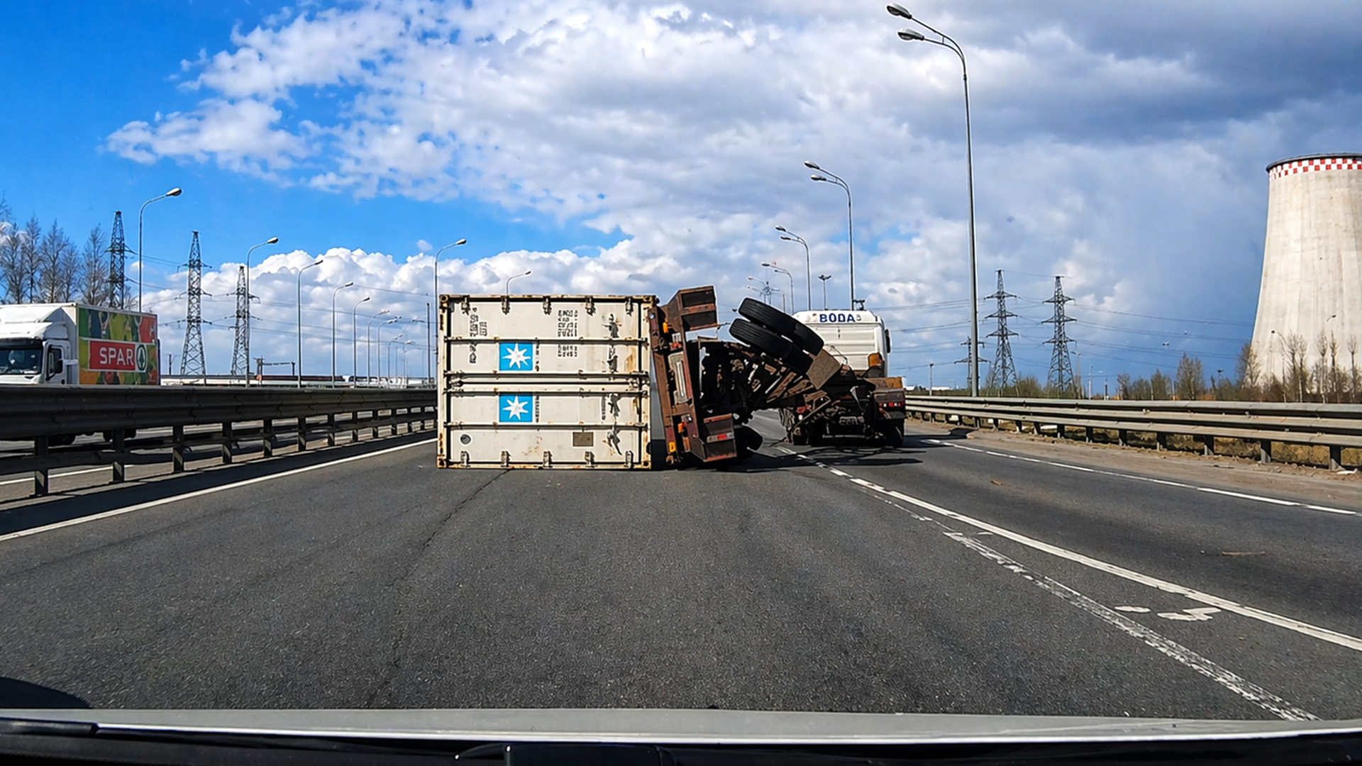 Out of control truck rolls over