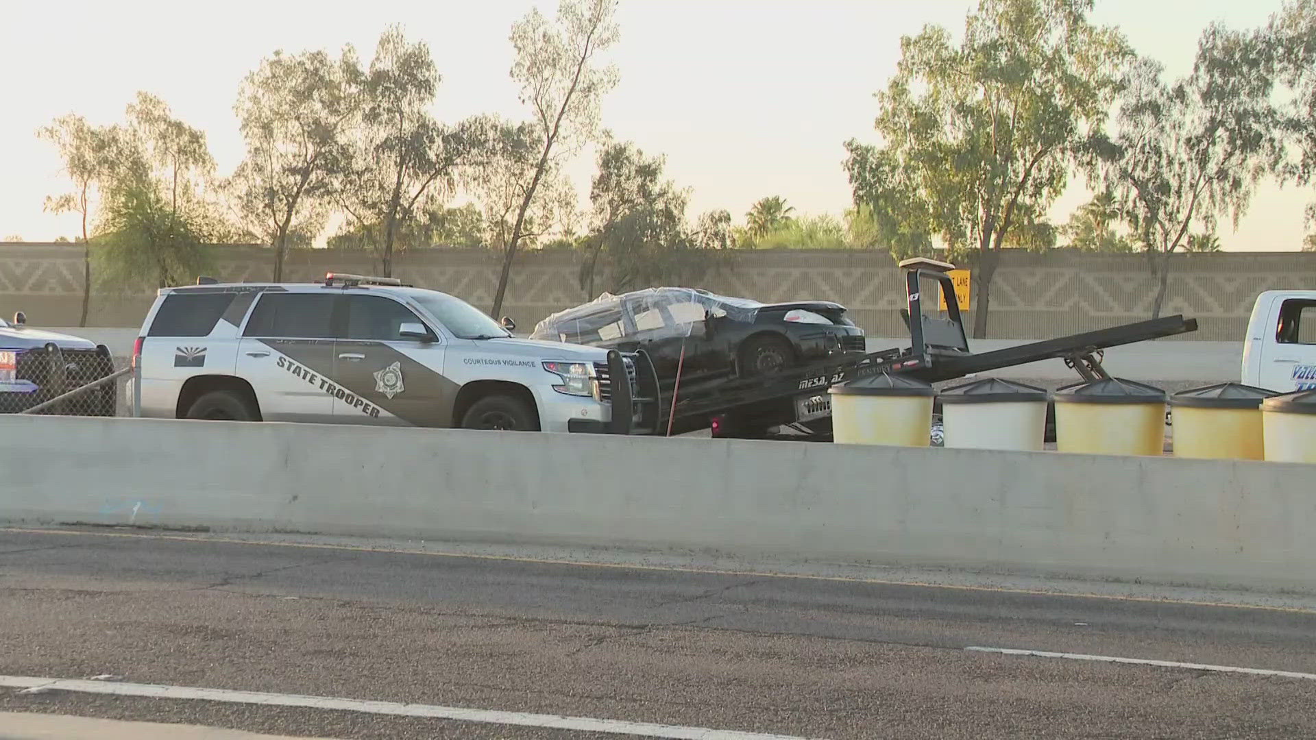Woman in custody after body found in burned car