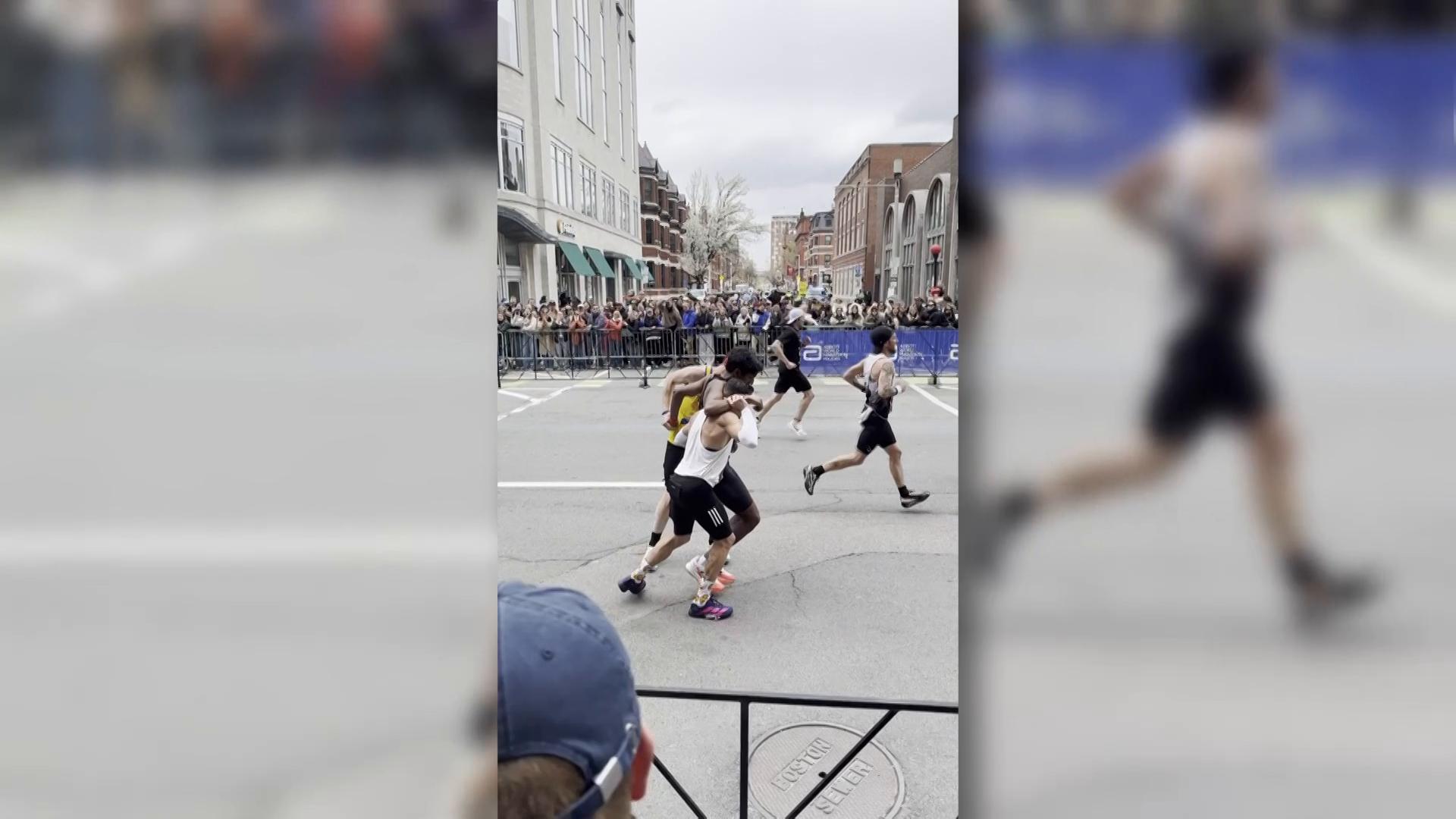 Runner collapses near Boston Marathon finish line and two competitors ...