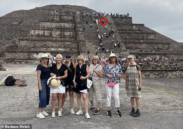 Tourists smile in front of Mexican pyramid with no idea that human ...