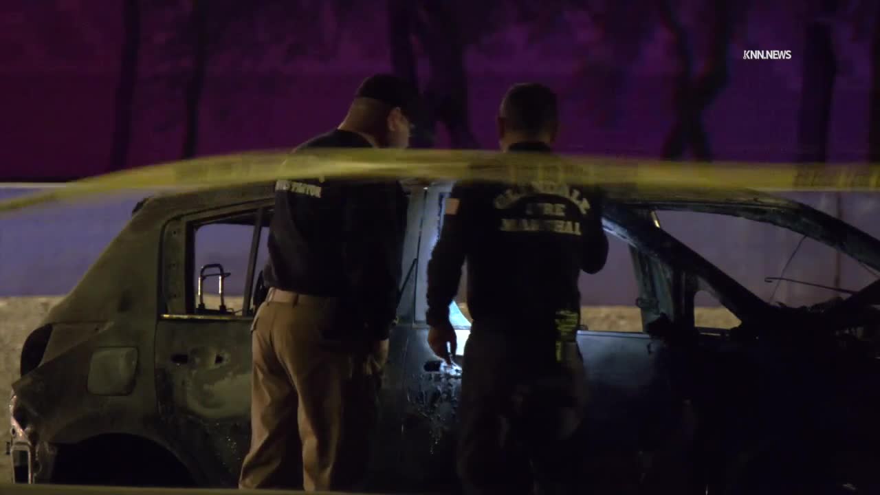 Woman in custody after body found in burning car along Loop 101 overnight