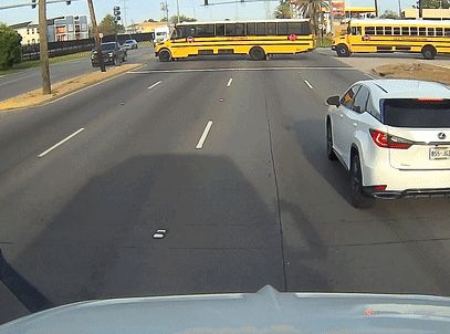 Harrowing moment school bus driver pulls into oncoming traffic, then stops