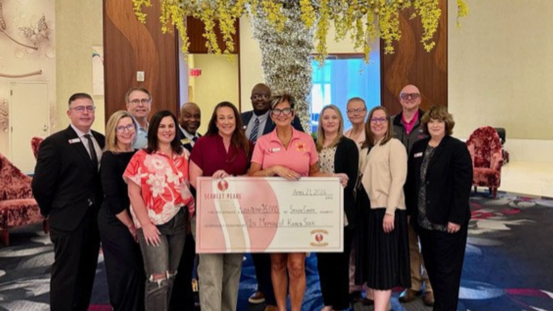 Coast community honors Karen Sock with donation to Shuck Cancer Gulf Coast