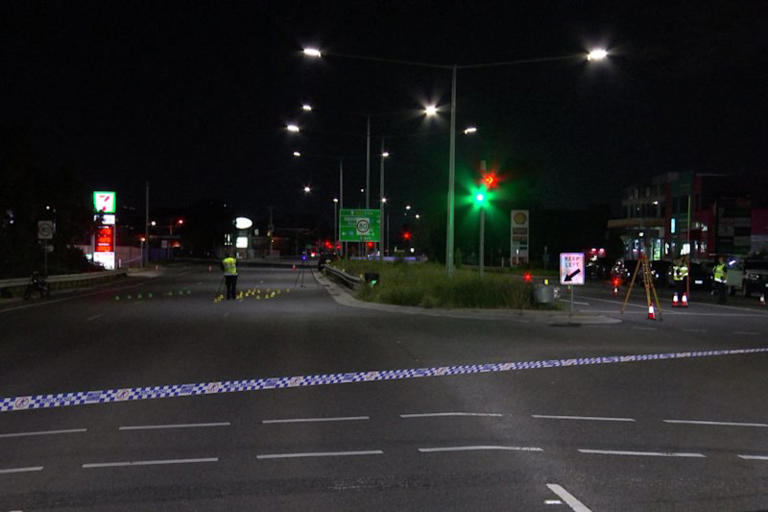 Police tape across the road where a fatal e-bike crash occurred.