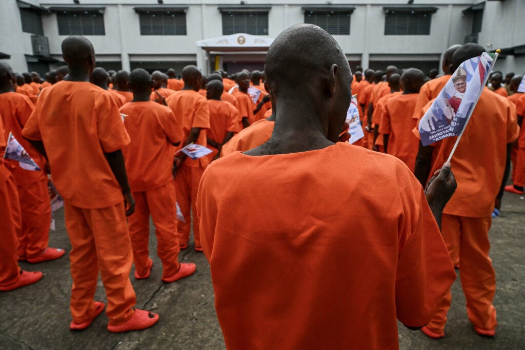 Pope visits freshly painted African prison, greeted by inmates dancing