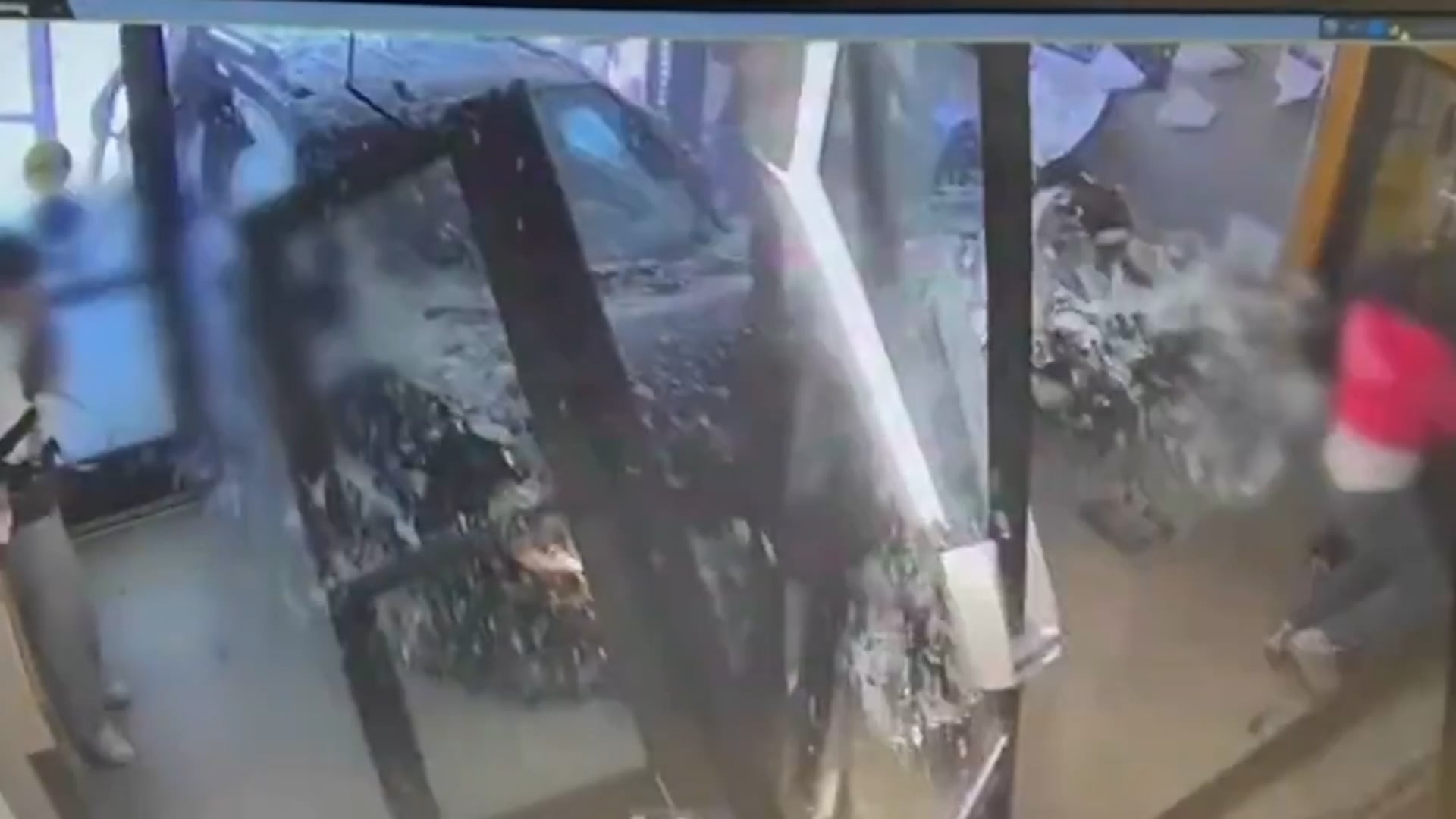 Car ploughs into police station as visitors flee in panic