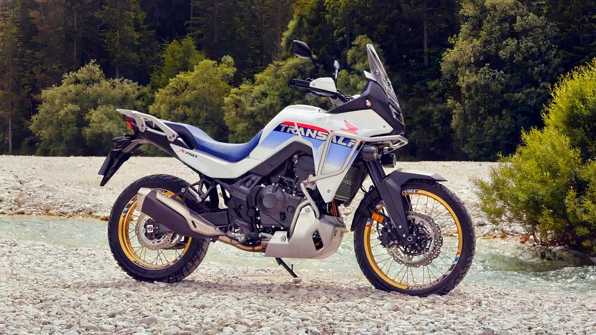 Honda XL750 Transalp parked off-road near a stream