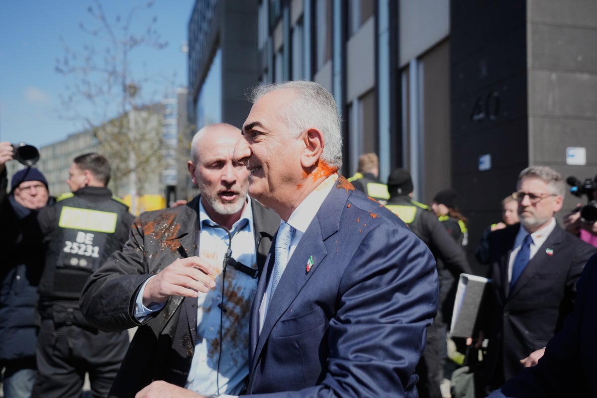 Iran’s exiled crown prince Reza Pahlavi splattered with red liquid in ...