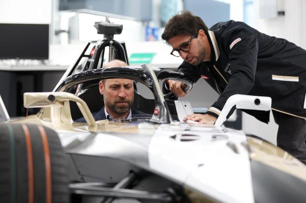 Prince William gets behind the wheel of Formula E racing car in Oxfordshire