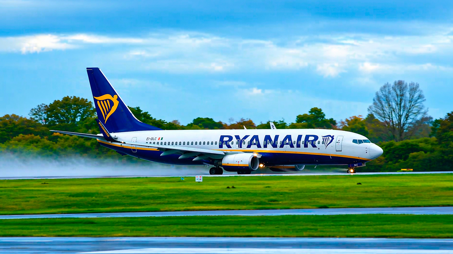 Jets blast through wet runway spray during takeoff