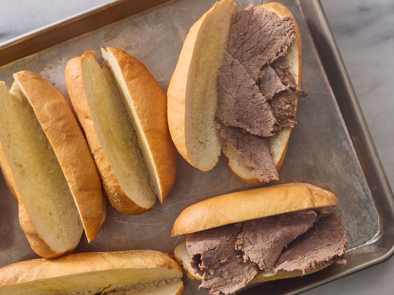 French Dip sandwiches with beef slices on buns