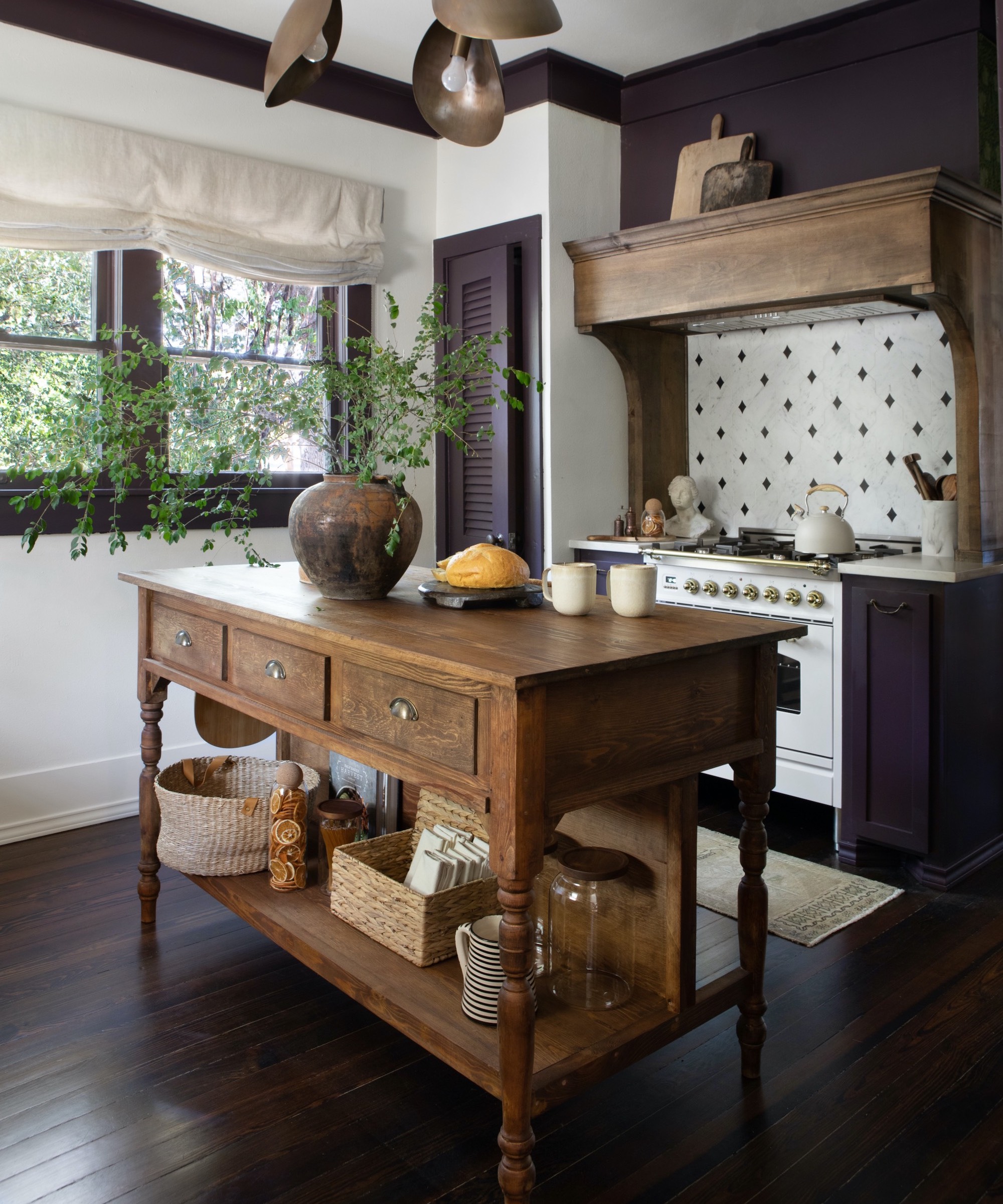 kitchen with reclaimed island and white range cooker