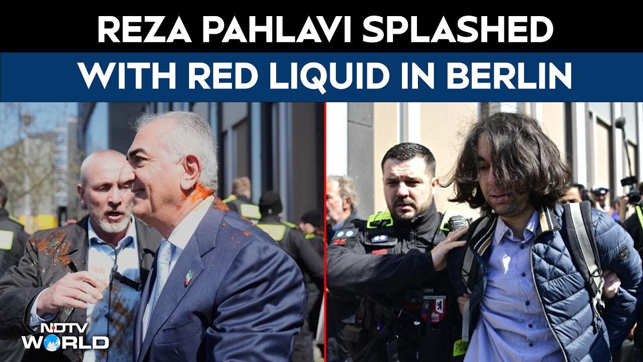 US Iran war | Reza Pahlavi splashed with red liquid in Berlin, dramatic  protest caught on camera | Watch